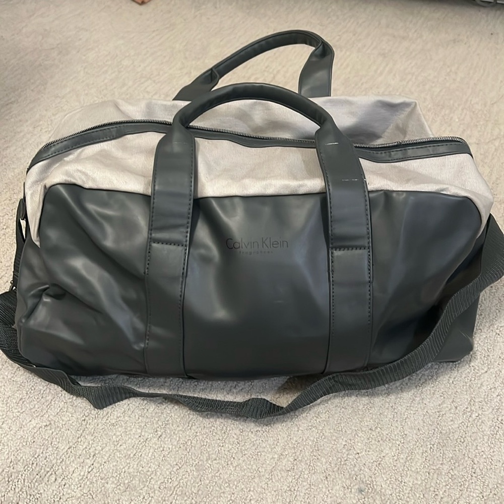 Calvin Klein gray duffle bag with long strap
